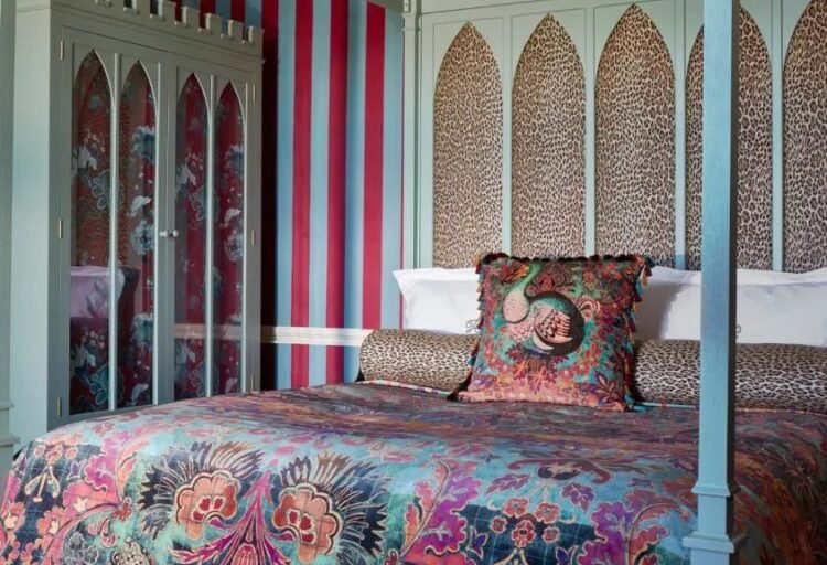 Andastra textile as bed linens in bedroom with fancy four-post bed