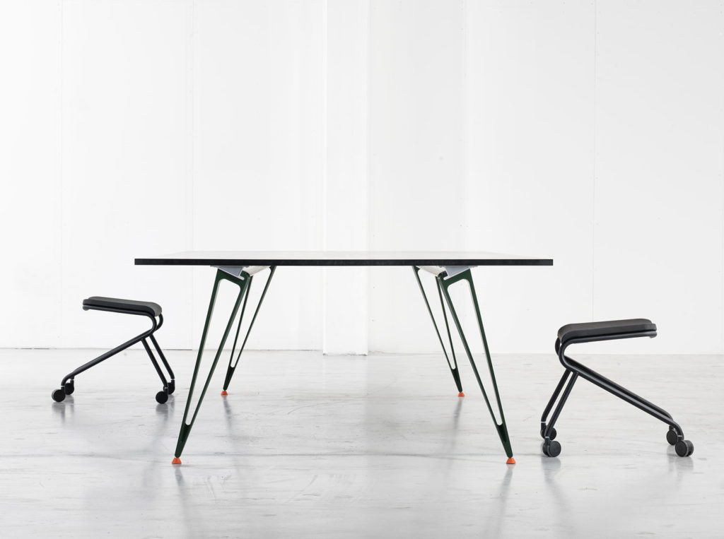 Attach table view from side showing rail system with two backless chairs in white room