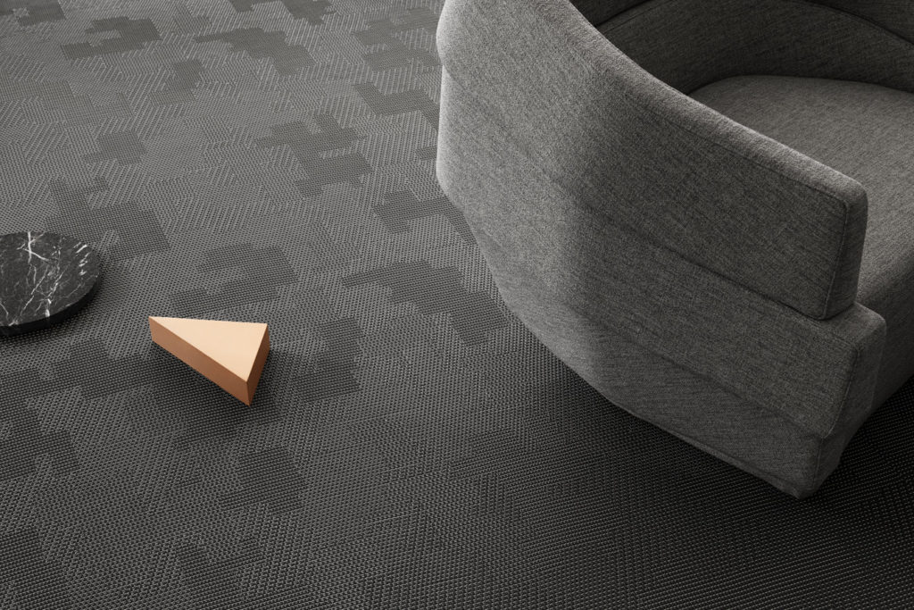 BOLON by Patricia Urquiola gray detail next to gray upholstered lounge chair 