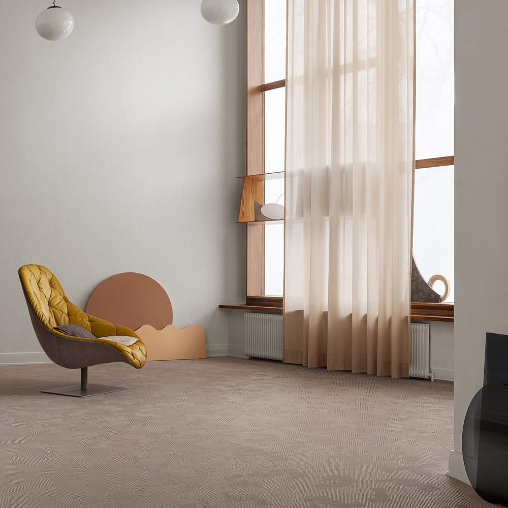 BOLON by Patricia Urquiola Nude in room with gauzy pink curtain and leather upholstered lounge chair