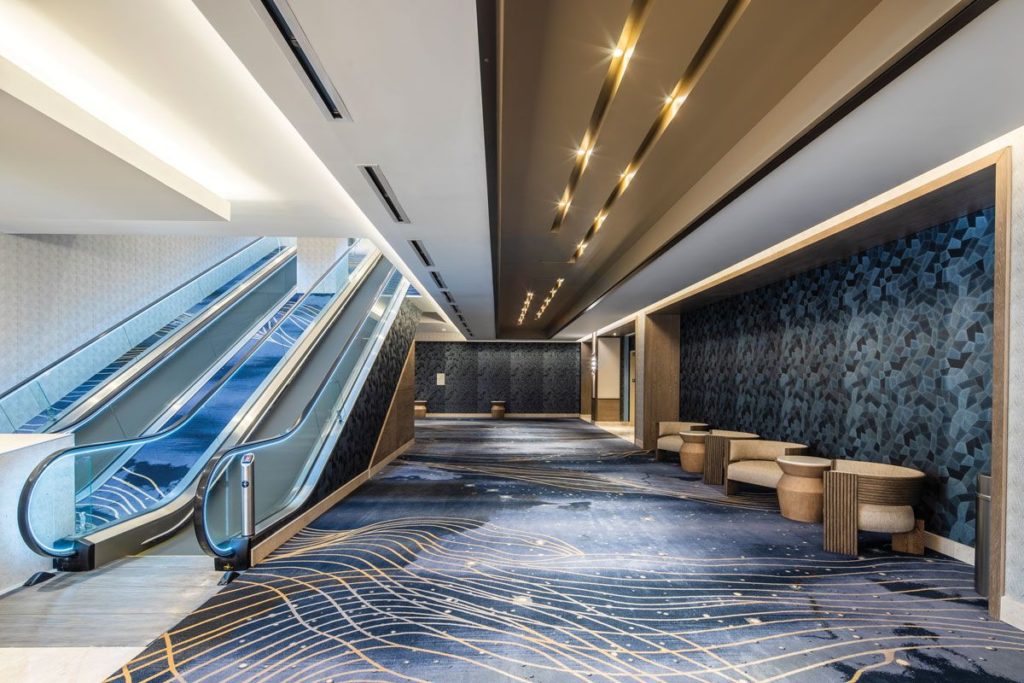 H.E. Williams Lighting recessed slot lights in corridor with moving sidewalk