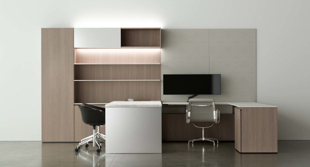 Innovant Palette in medium-tone wood with attached desks and two black chairs and one gray chair