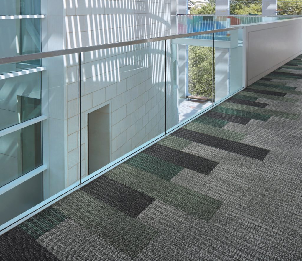 Rising Signs Carpet Tiles Karmic Relief bar graph type shapes in different colors against a neutral background