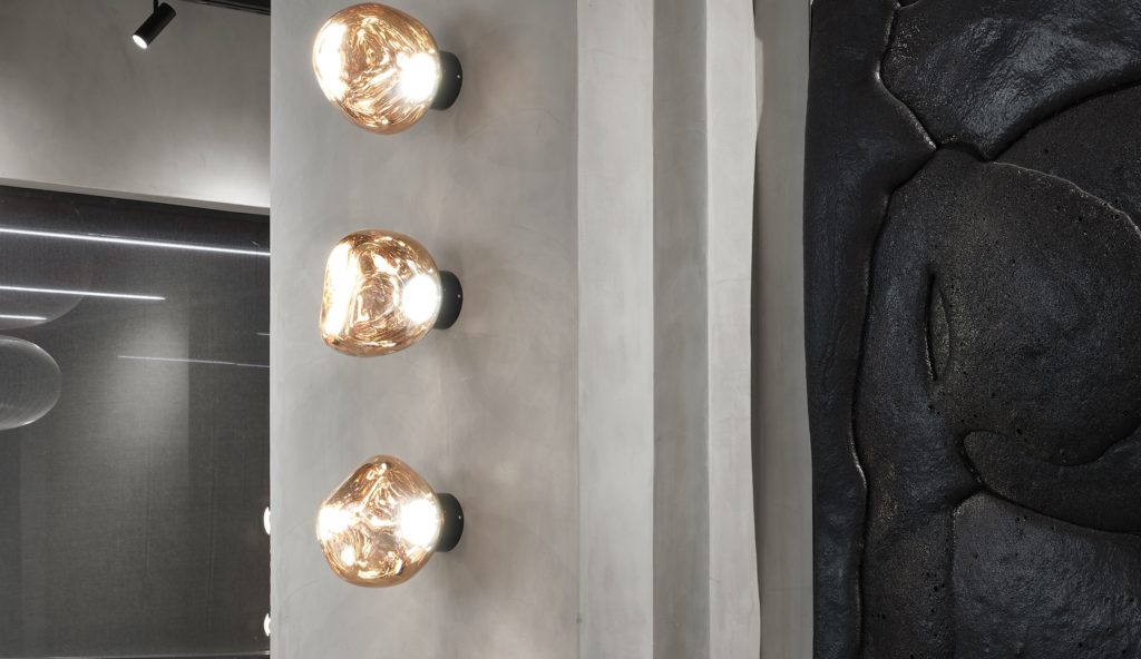 Tom Dixon Melt wall lamp on concrete wall 