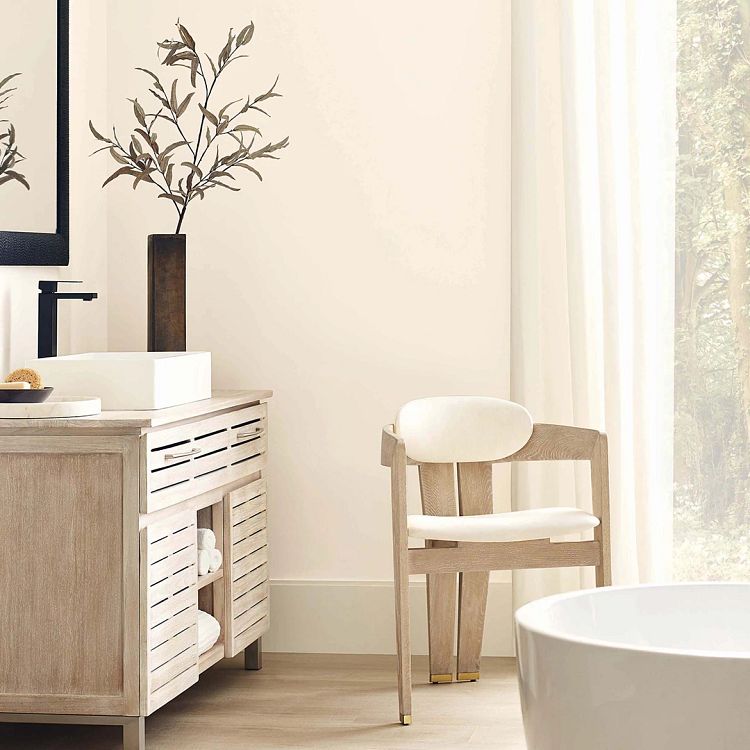 MODE method beige in bathroom with sink and chair near tube and partial view of window
