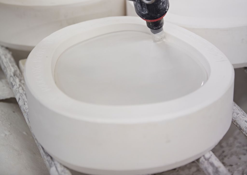 Original BTC Pebble Pendant manufacturing liquid clay settling in mould