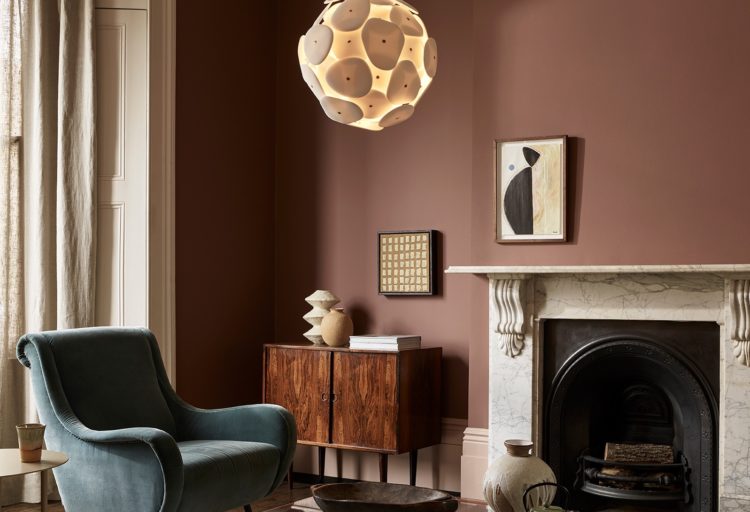 Original BTC Pebble Pendant in living room above chair next to fireplace