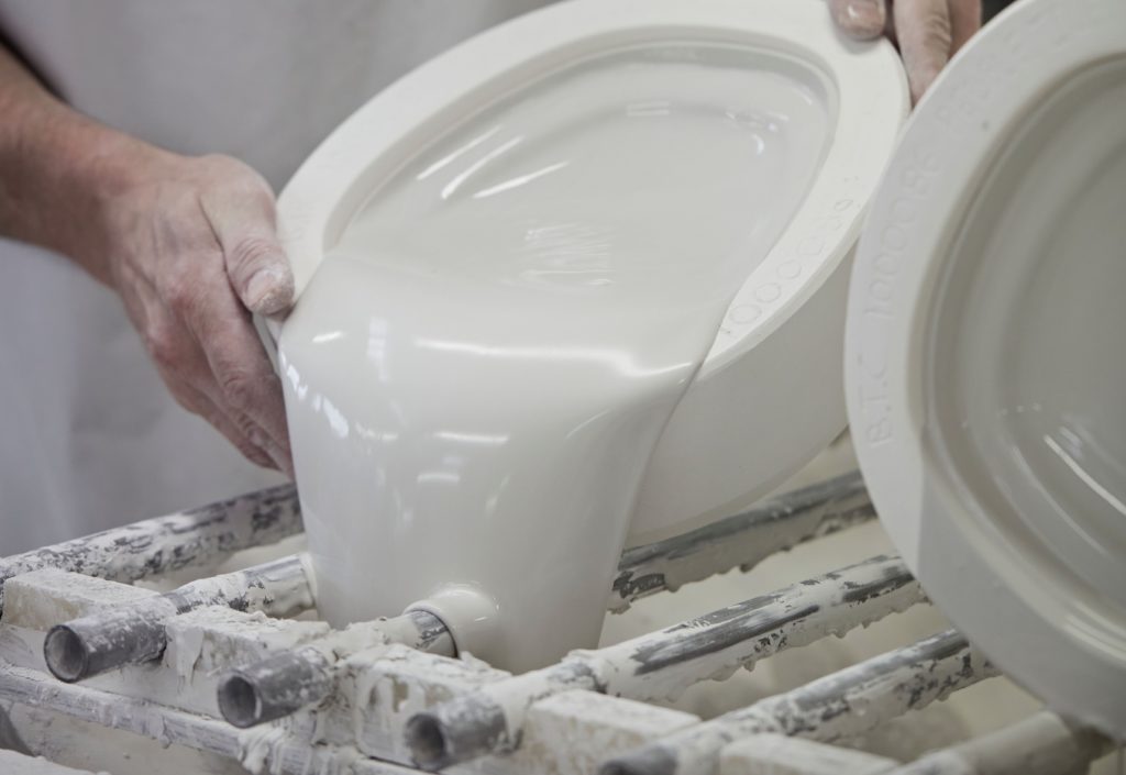 Original BTC Pebble Pendant manufacturing pouring out liquid clay from mould