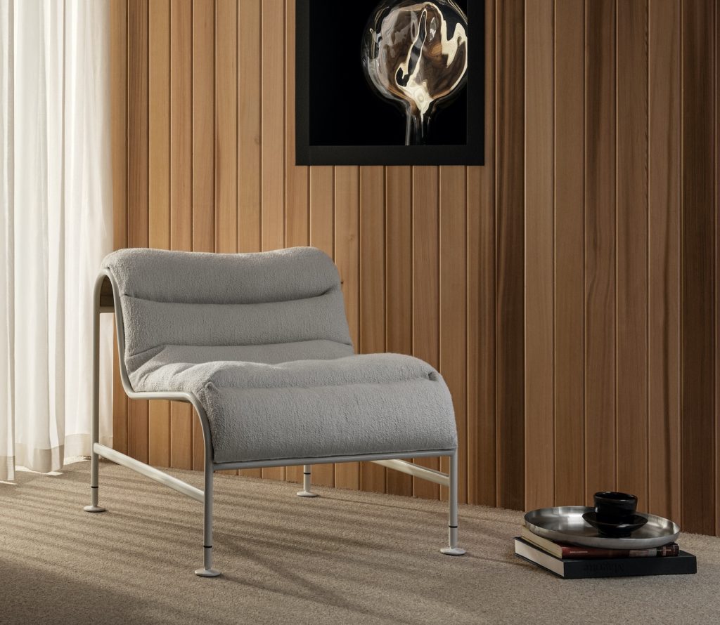 Sunny Chair gray in nice room with wood paneling and beige carpet