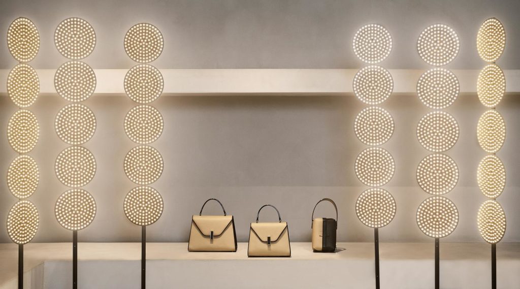 Tom Dixon black light LED sculpture circular circuit boards mounted on upright black rod six sculptures in total with Valextra hand bags 