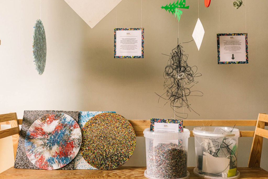 Waste as resource exhibit with art made from reconstituted paper and plastic