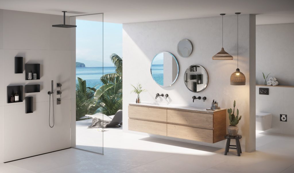 C-BOX wide view from side with five black units installed on white shower wall in open shower with bathroom vanity and an opening to the outdoors with ocean view