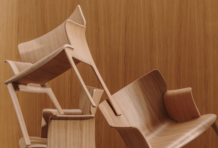 Adela Rex chairs balancing atop each other