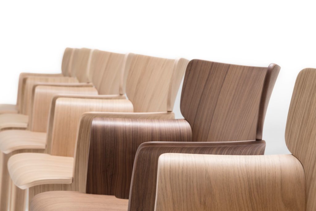 Adela Rex profile view of row of chairs several oak and one walnut