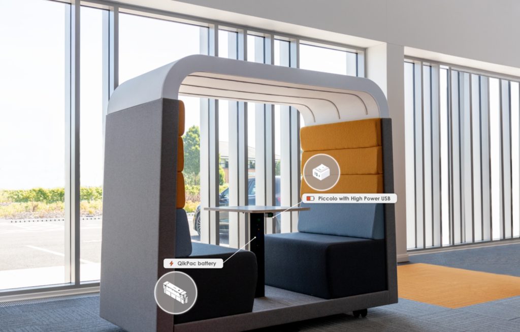 Animate Power Modules in privacy booth with gray exterior and blue bench-style seating