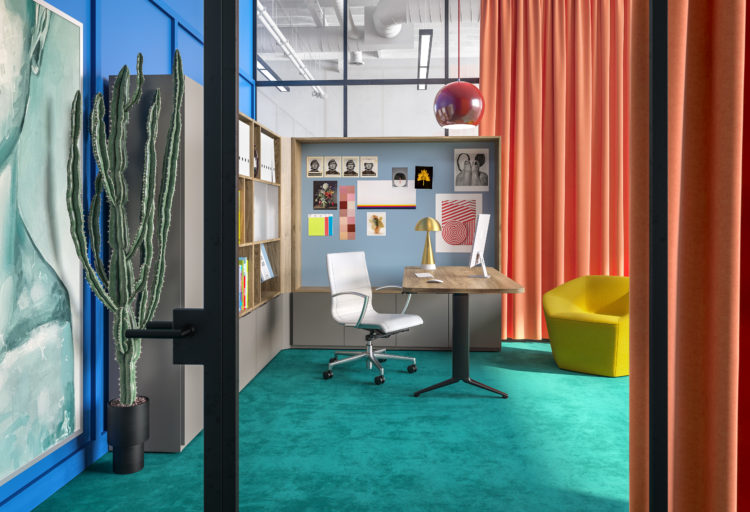 EverySpace private workstation colorful palette of greens and oranges with storage modules next to and above desk