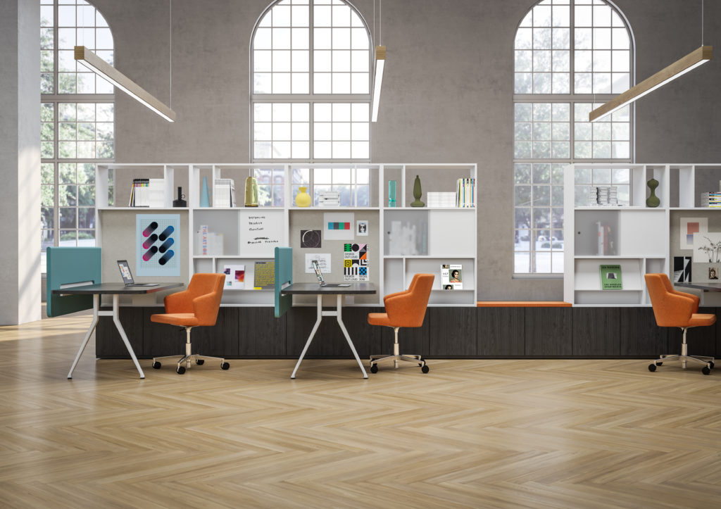 EverySpace open workspace with matching desks with black tops, white bases, orange chairs, and storage modules next to desks