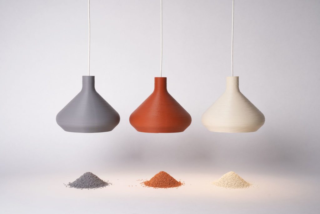 3form three LightArt pendants with granular material used to create them beneath