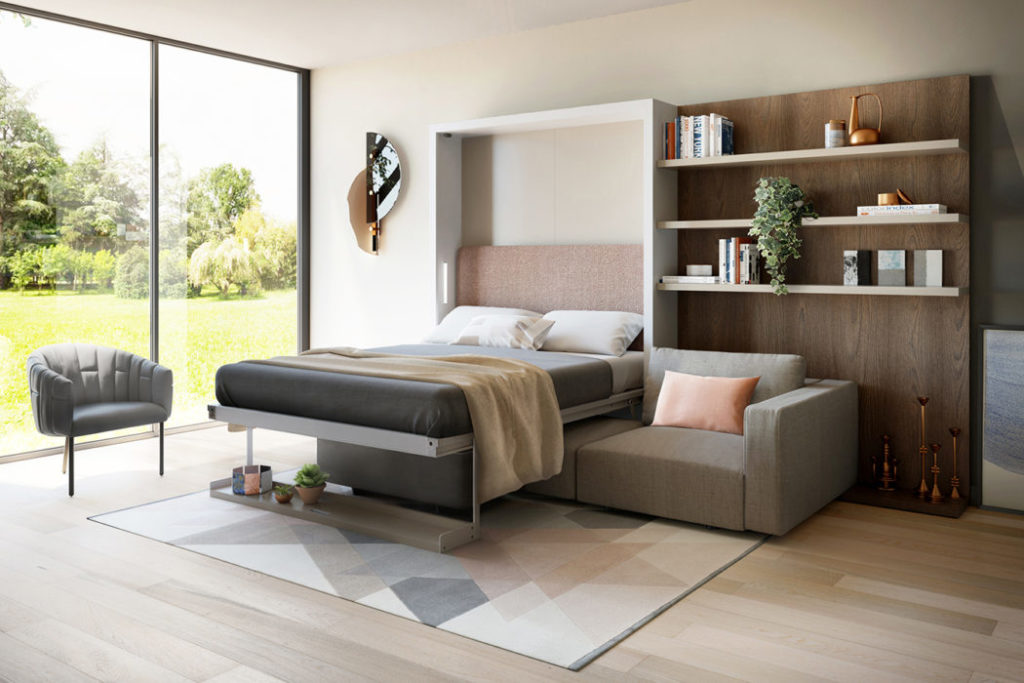 Swing as bed gray upholstery with bookshelf and chair and view of backyard
