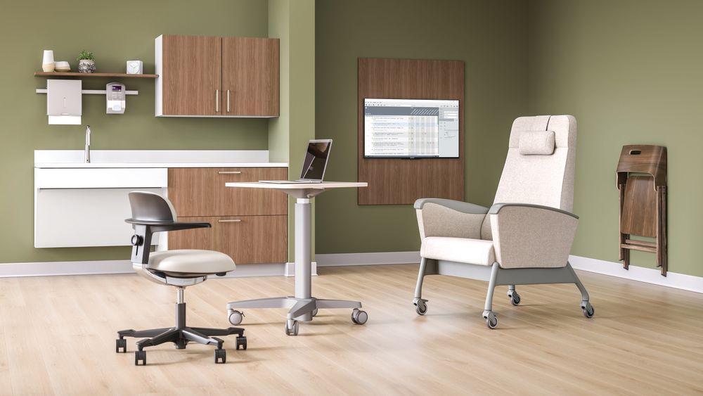 Embra Ezzeri patient recliner in patient room with Dr.'s stool