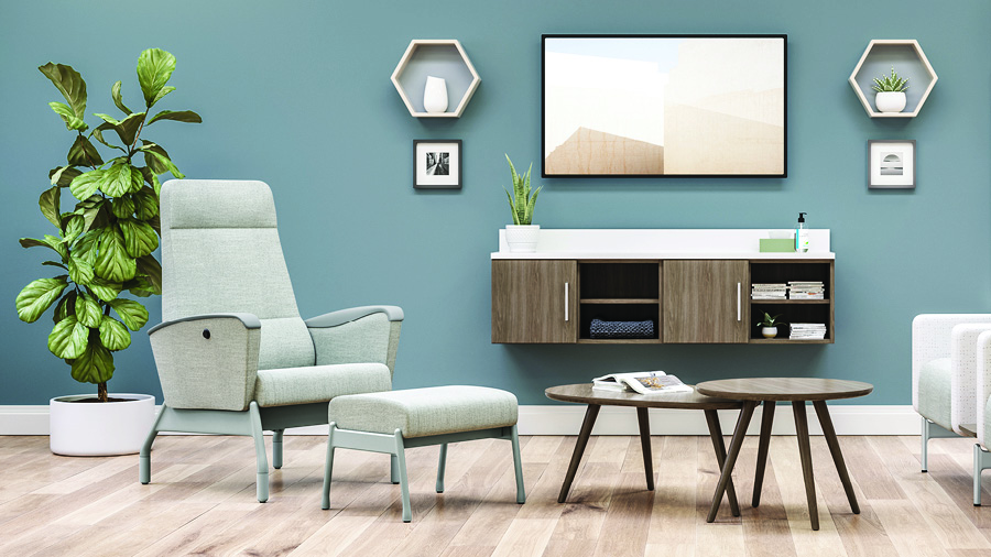 Embra patient recliner in mint green in patient room with tables, ottoman and storage