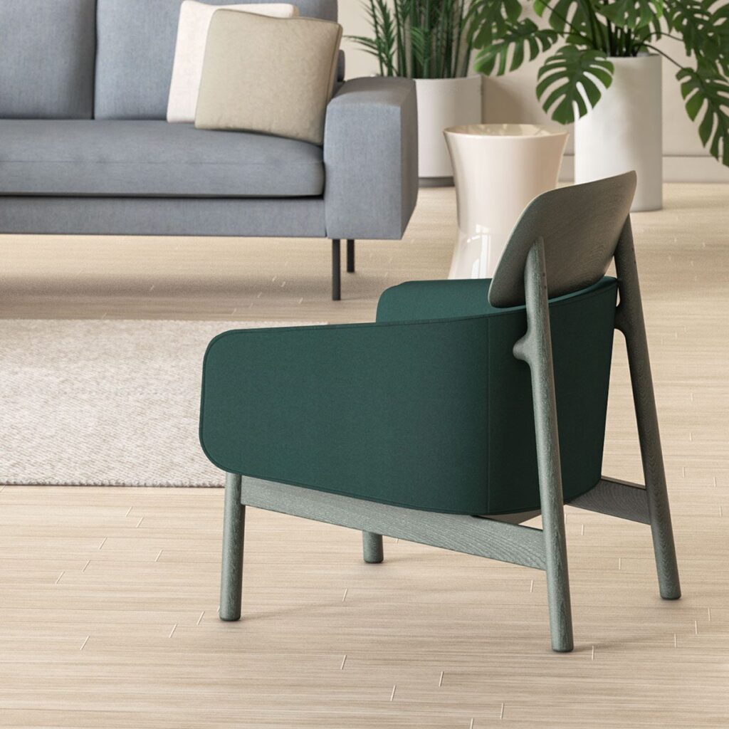 Toluca Chair green upholstery with gray frame and headrest and partial view of sofa