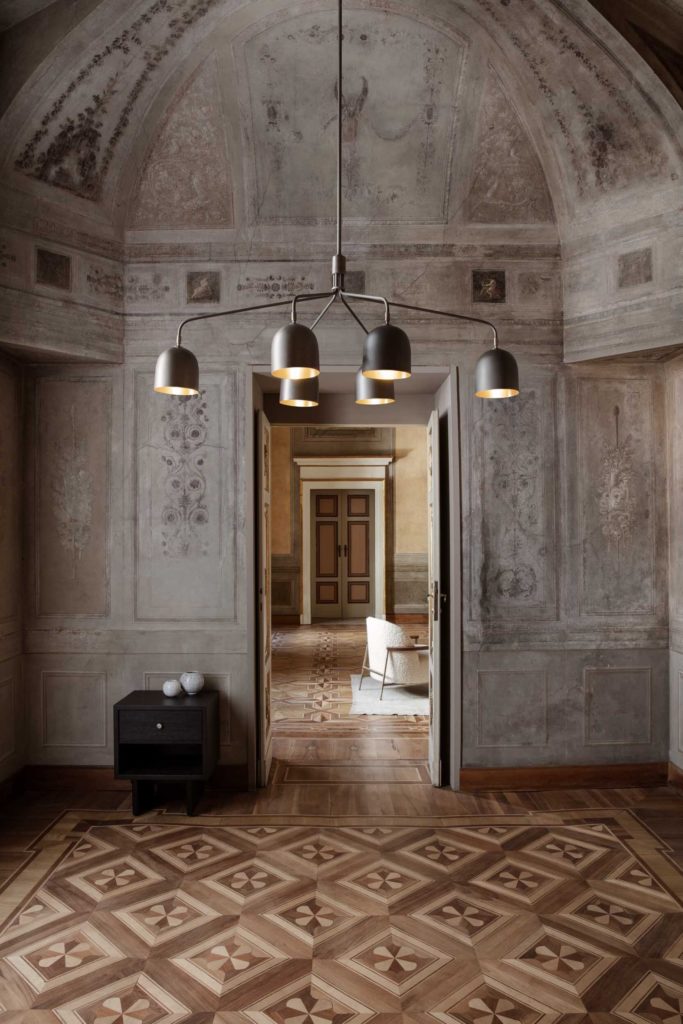 Howard chandelier in cavernous space of historical house
