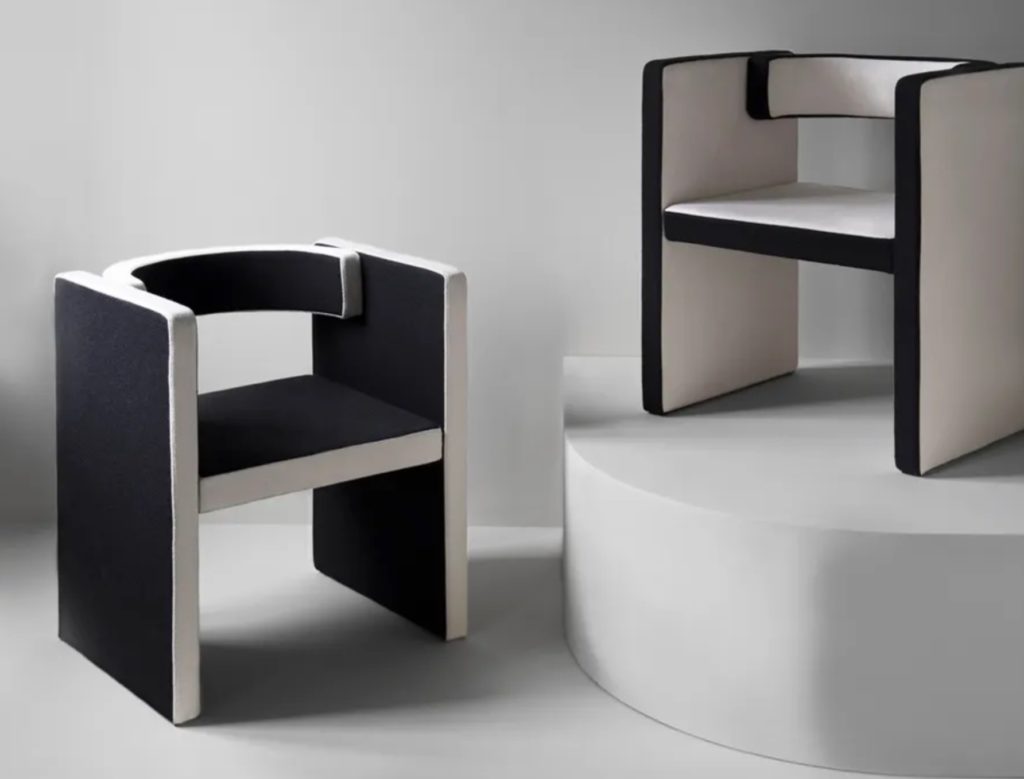 Friends & Founders Novel Chair in black and white one on a pedestal