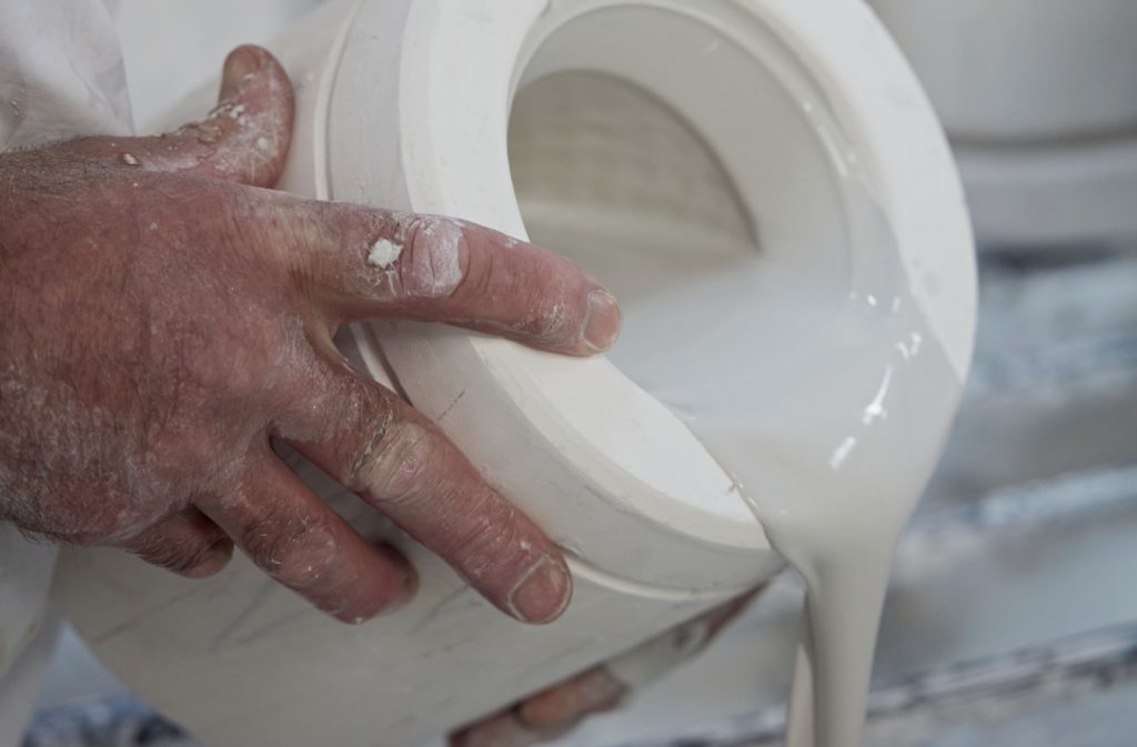 Oxford Double during manufacture pouring liquid slip from mould