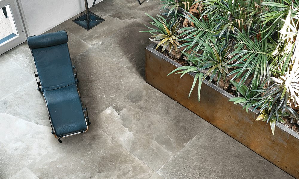 Rock Salt Collection view from above on gray/white tile floor with blue chaise lounge and planter