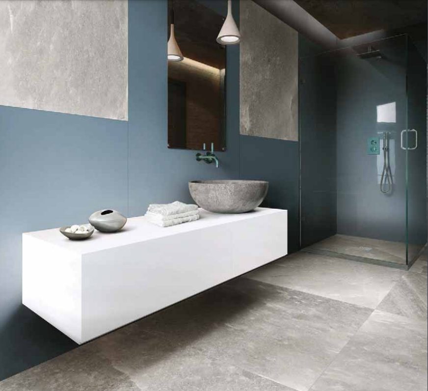 Rock Salt Collection gray/white tile in bathroom with white vanity and glass shower
