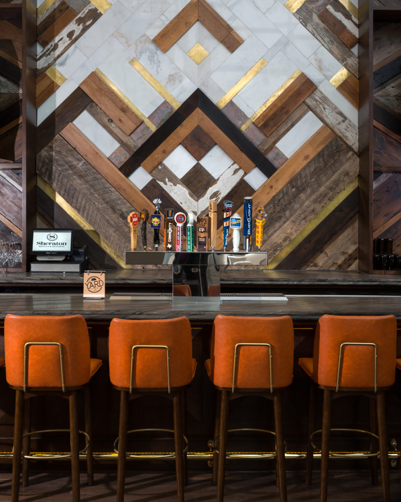 Brass Plan n Design image of wall feature with wood, tile, and inlaid brass