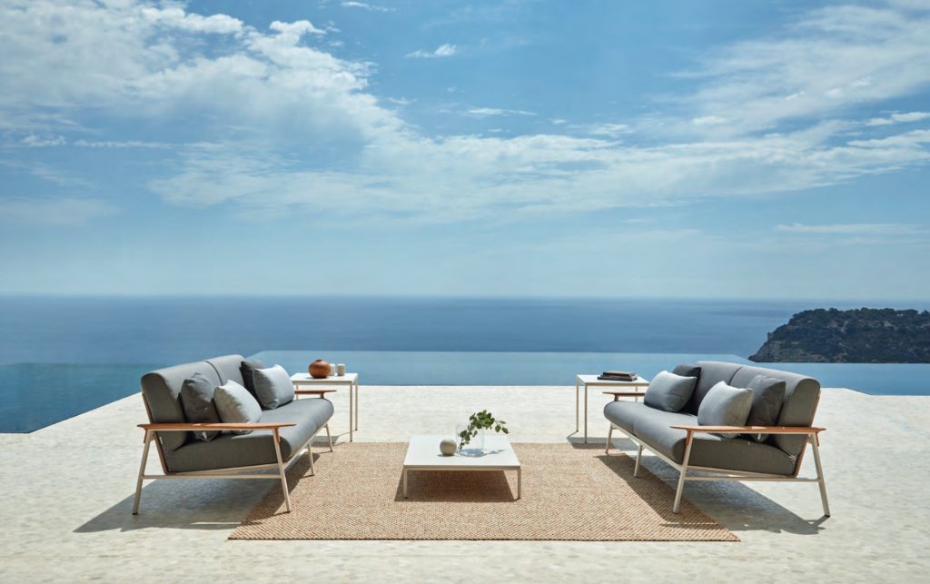 Point City Collection two sofas facing each other with coffee table on the ocean