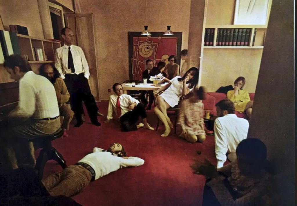 Casa Lana original image of living room with many people lounging around
