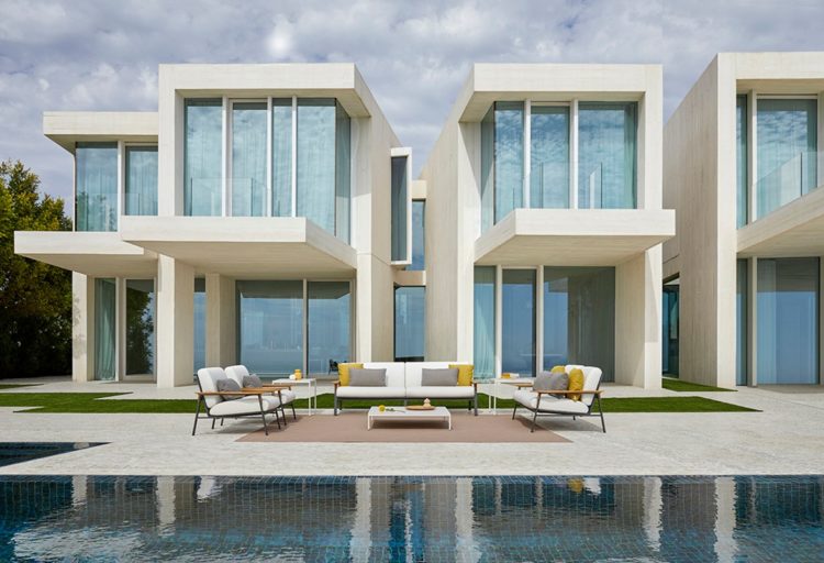 Point City Collection long view of furniture in front of modern home with lots of glass