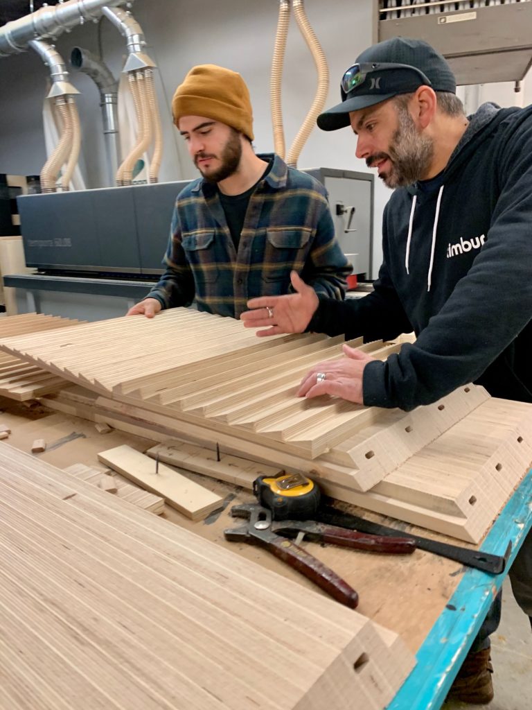 Timbur artisans making Fresnel credenza