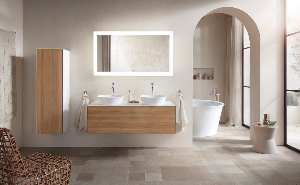 White Tulip vanity and matching cabinet with wood fronts and partial glimpse of tub