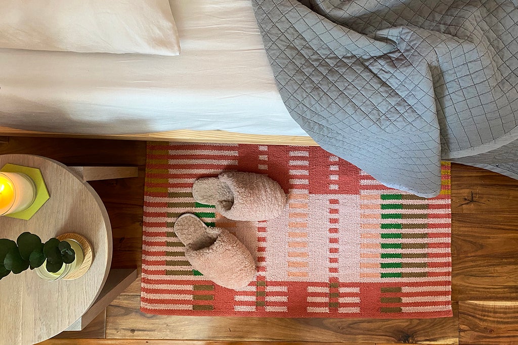 bedroom with Peach area rug by Jessica Poundstone