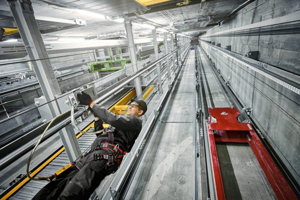 TK Elevator maintenance man in elevator shaft