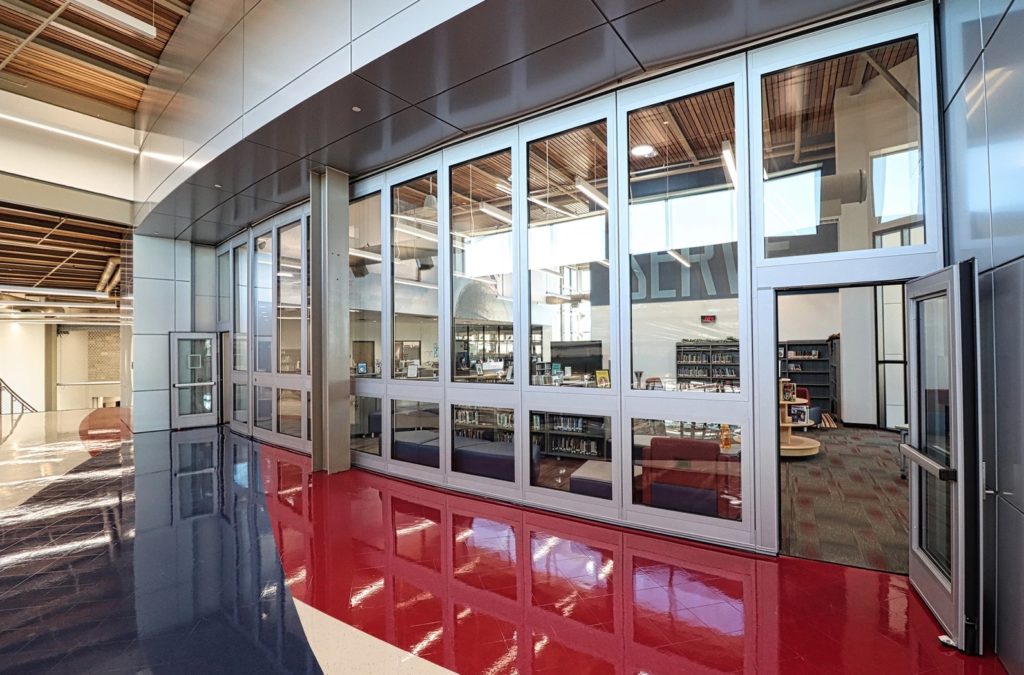 glass panel walls high doors in library