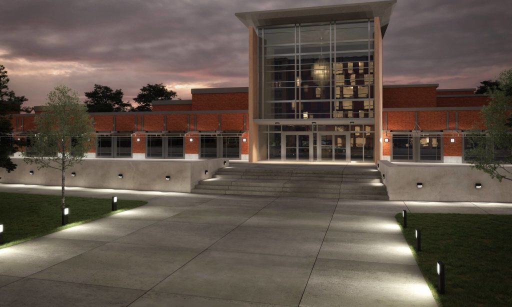 Scena many bollards and wall-mount lights on grounds and exterior of building