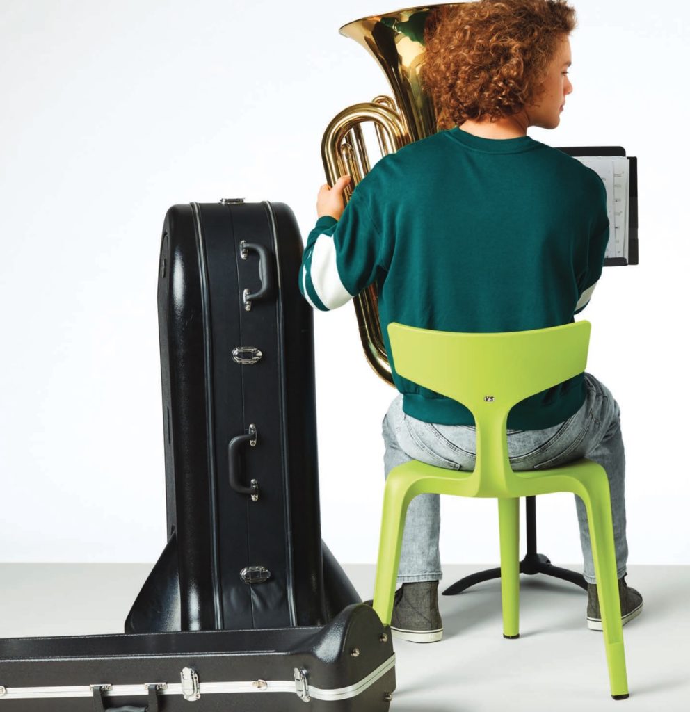 Stakki lime green view from behind with boy playing tuba