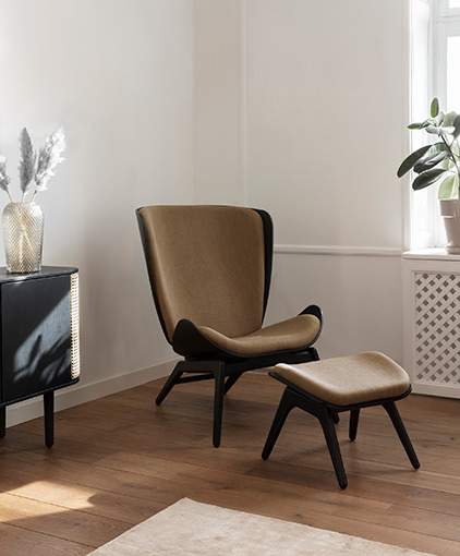 Umage reader black oak with brown sugar upholstery in sitting room