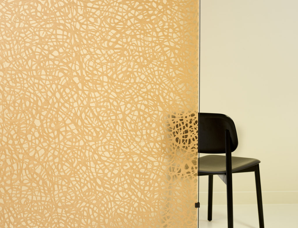 Amber partition with partial view of chair