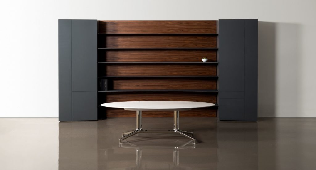 Desk in front of storage wall