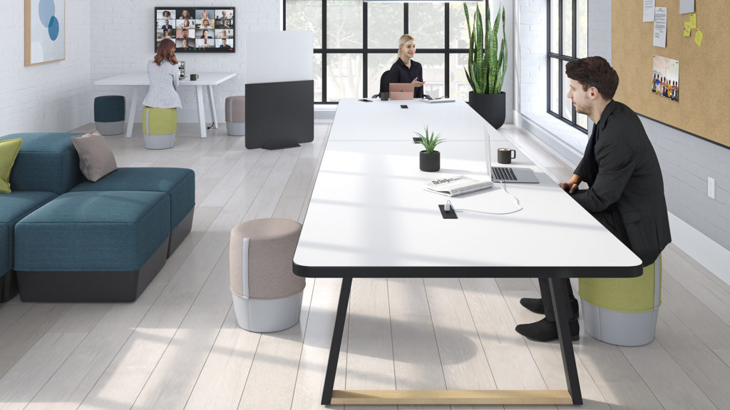 man and woman at long table with white top and black base