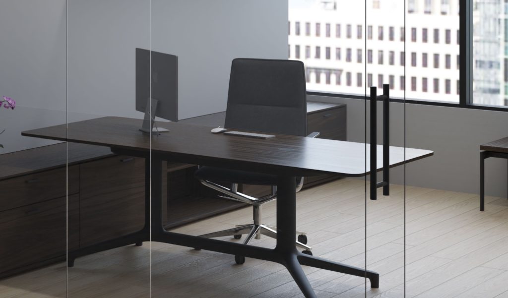 Helm long table behind glass wall