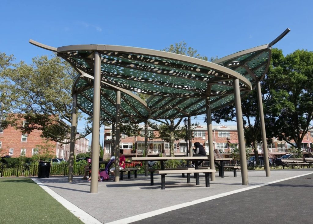 Parasoleil shade structure over public picnic tables in Brooklyn