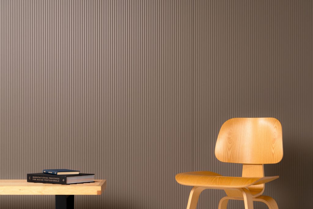3form Elements panel on wall with table and chair in front