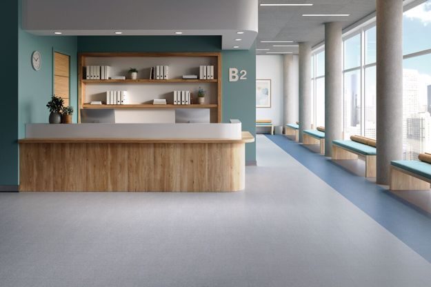 vinyl-based tile in reception area light colors, off-white and baby blue
